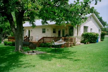 View of the rear of the lake house facing the lake